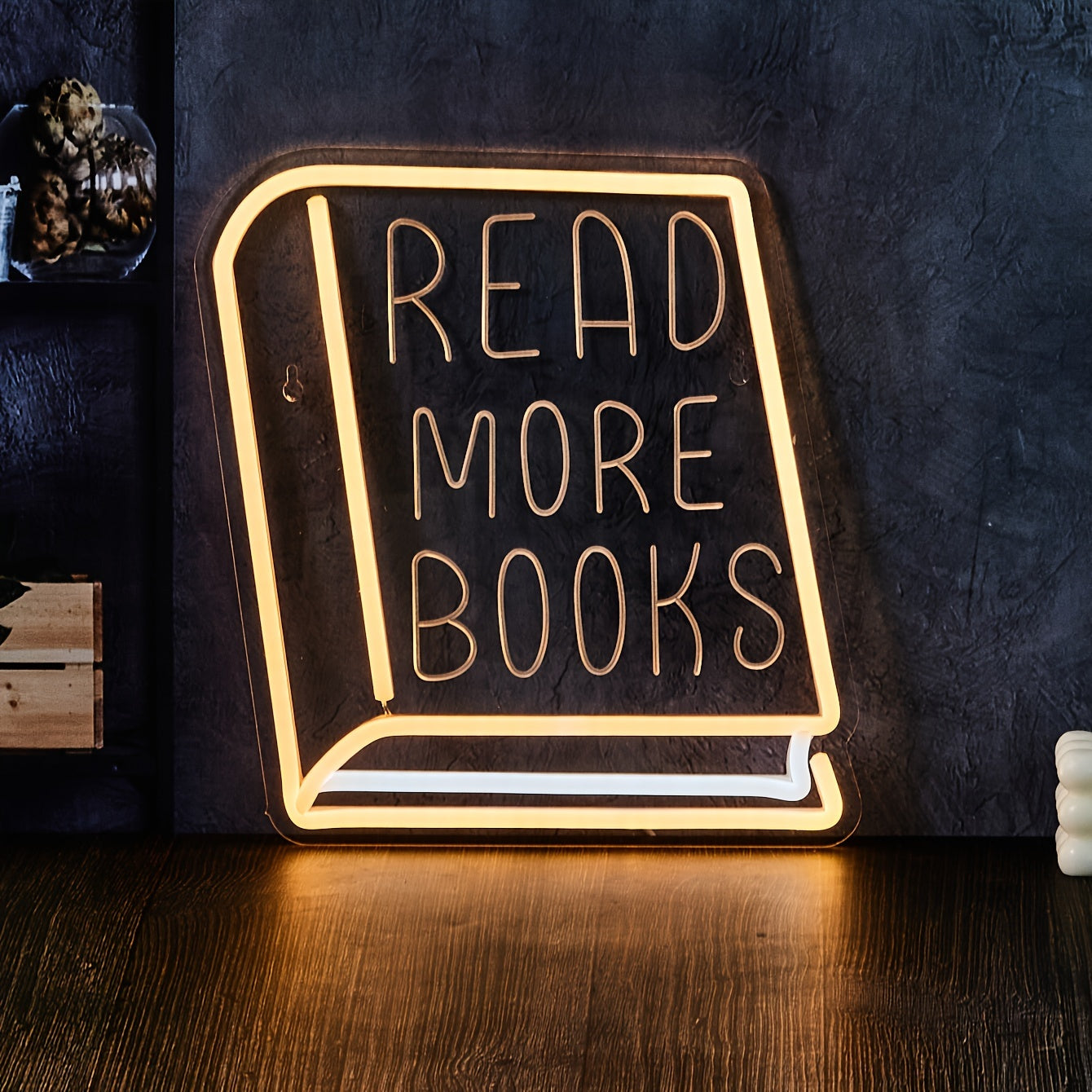 Neon "READ MORE BOOKS" sign for book lovers, perfect for home or office décor. Ideal for girls' bedroom and study area. USB-powered and wall-mounted.