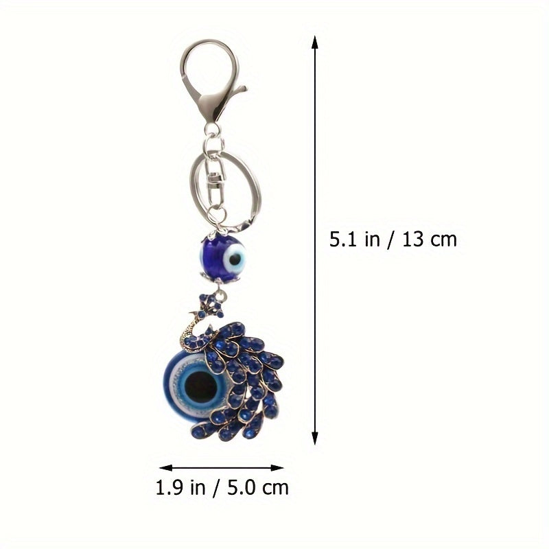 Blue Evil Eye Keychain with Rhinestone Inlaid Peacock Design, made from Alloy, Perfect for Women's Daily Use as a Trendy Hanging Pendant or Bag Charm.