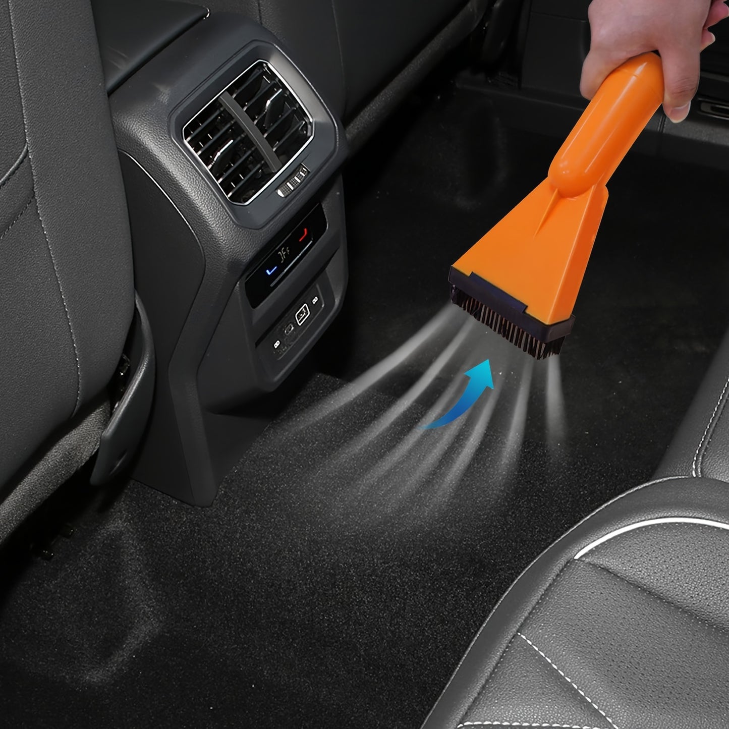 Car vacuum cleaner with suction and blowing capabilities for interior cleaning, mounted on vehicle.