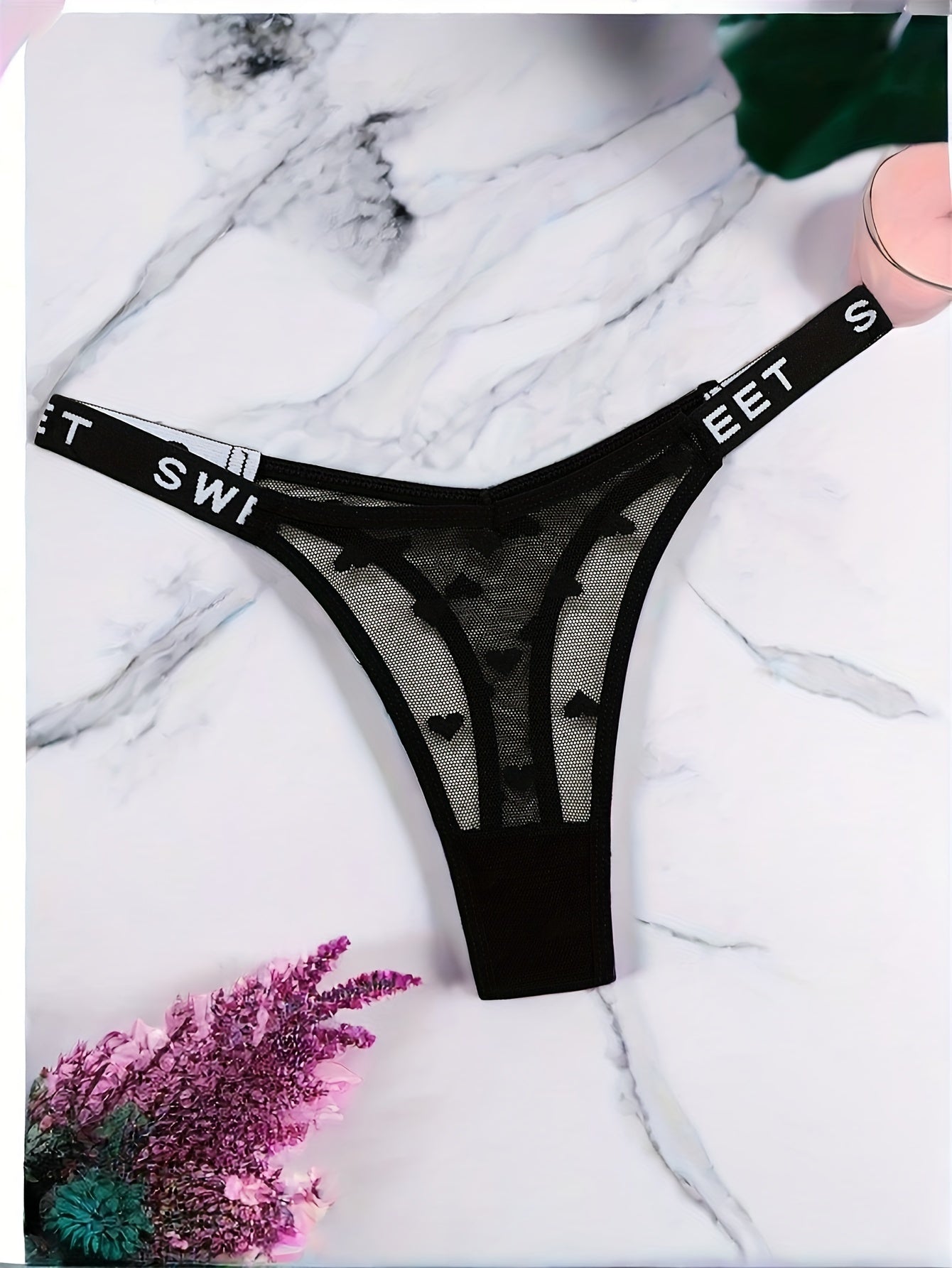 Stylish polyamide blend thong underwear with heart pattern, mesh design, and comfortable stretch fit.