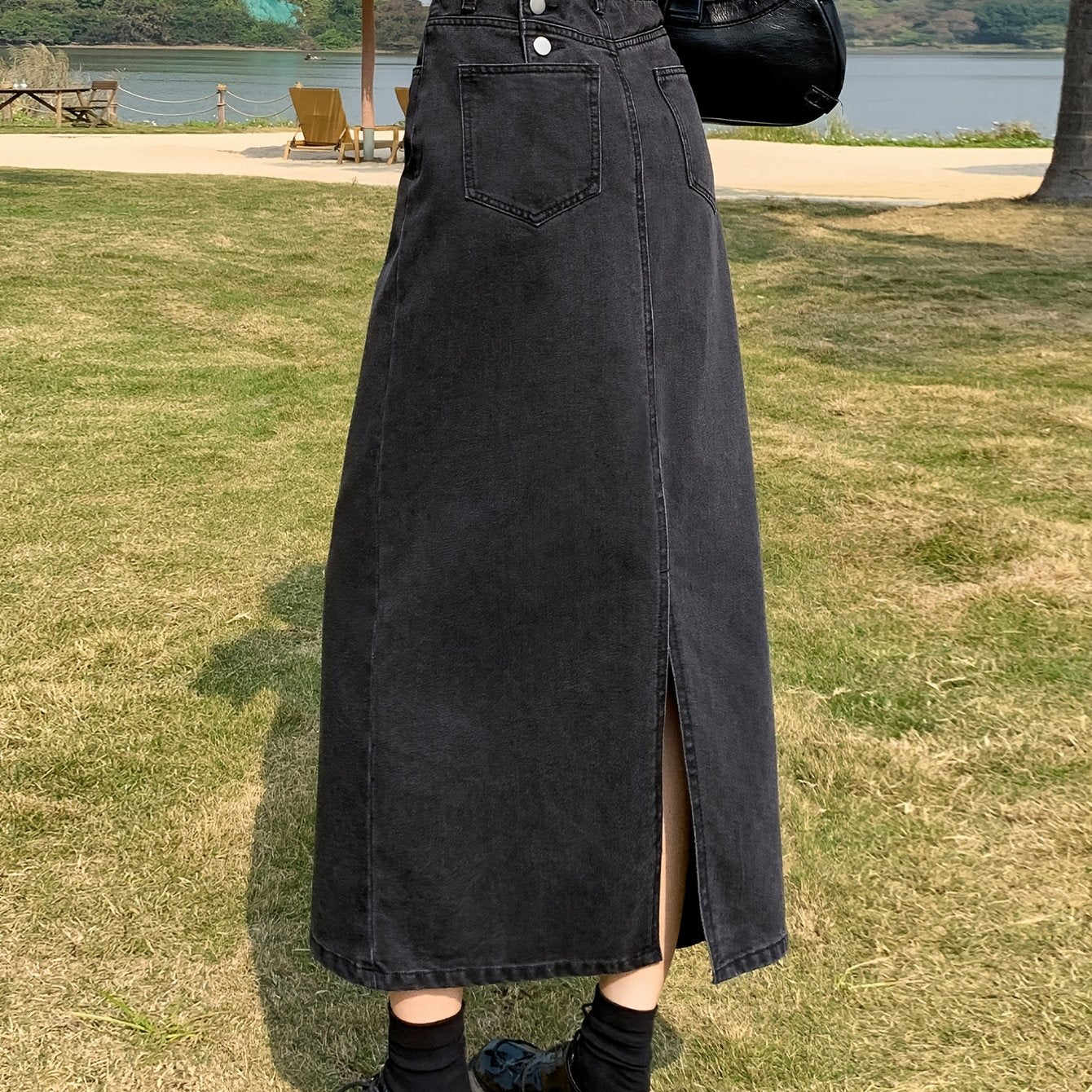 Casual denim midi skirt for women with side slit, mid-rise waist, straight cut, solid color, and pockets. Made of 55% cotton and 45% polyester blend.