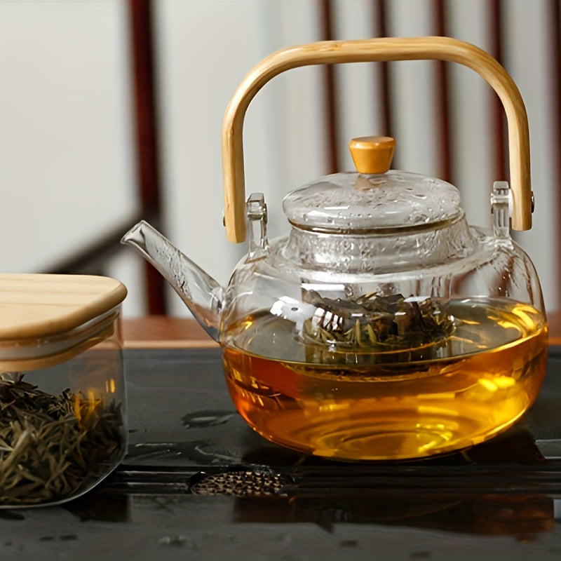 Glass teapot with bamboo handle and removable infuser, 34oz capacity. Made of heat-resistant clear borosilicate glass. Ideal for brewing loose leaf tea.