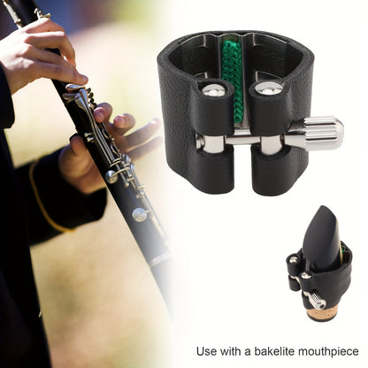 Black faux leather clarinet ligature with adjustable screws and shock-absorbing fastener for B flat clarinet.