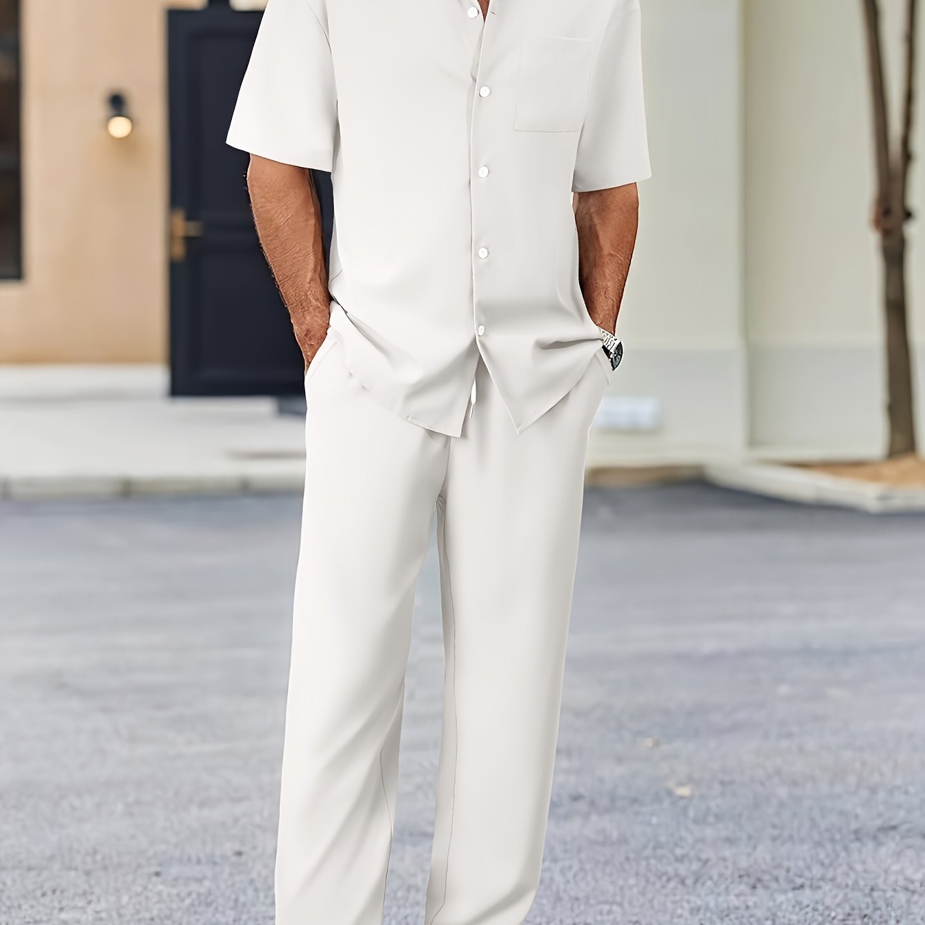 Men's casual suit-inspired set includes short sleeve shirt and loose straight pants made of polyester, machine washable.