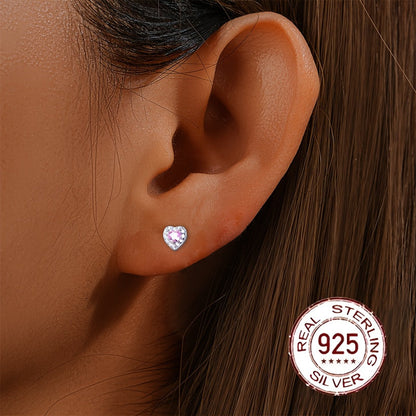 These stylish and versatile earrings are crafted from S925 sterling silver and feature sparkling zirconia in a heart-shaped design. Perfect for daily wear, gifting, or vacation, they have a silvery weight of 0.7-0.5g.