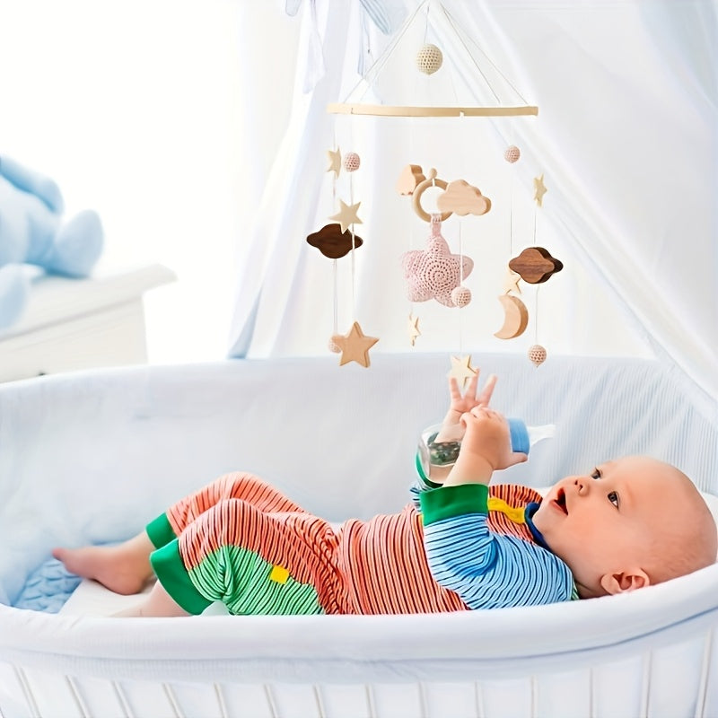 Hand-crocheted wooden bed bell with stars, perfect for crib or stroller.