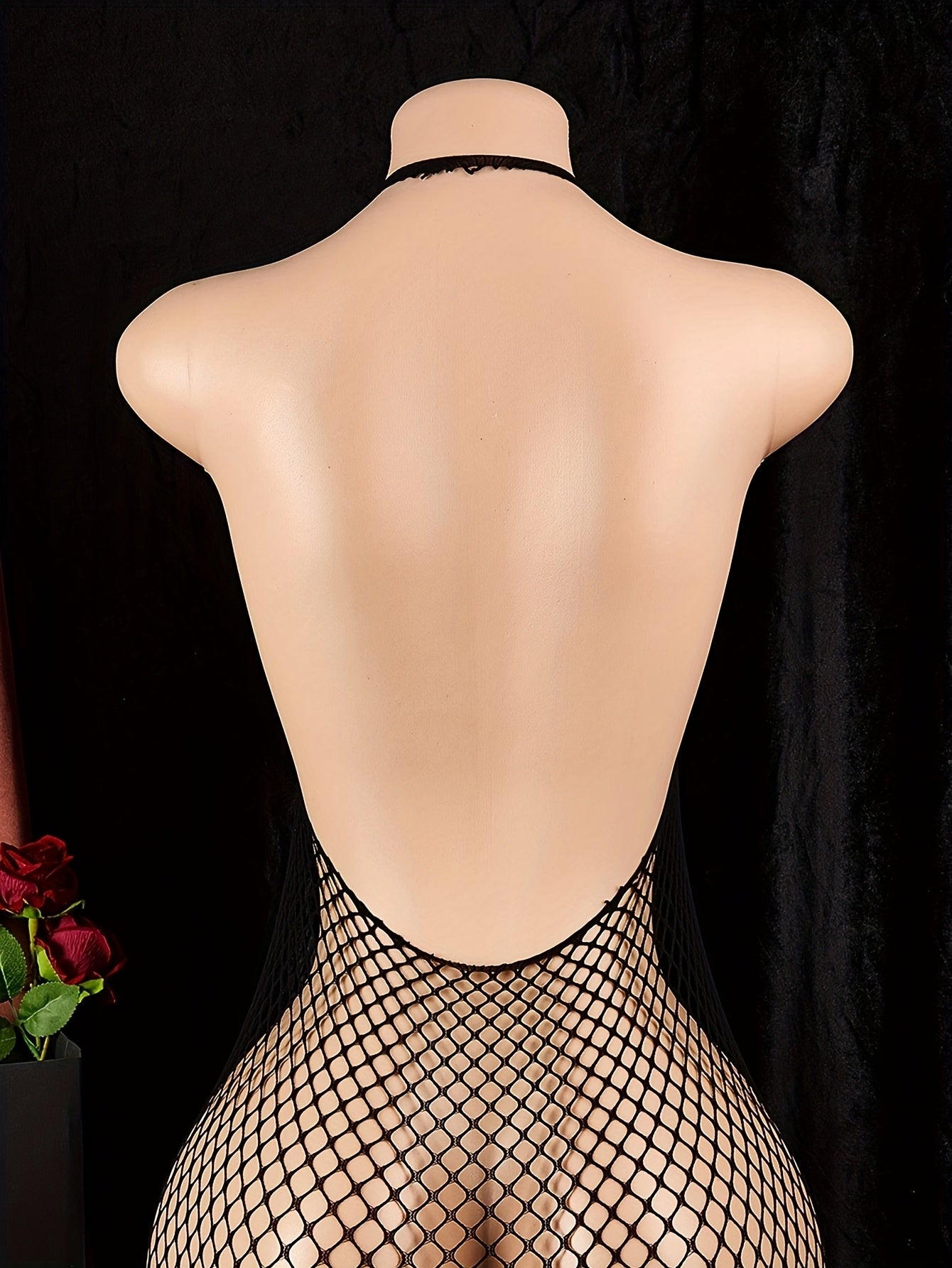 Backless mesh jumpsuit with cut-out lingerie design, made from high stretch nylon and elastane for a sexy style