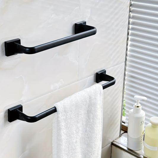 Small black towel bar for organizing bathroom towels.