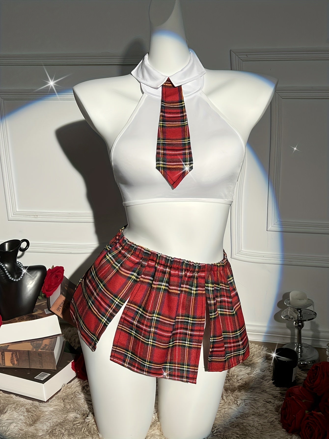 4-piece plaid uniform set for women with crop top, tie, thong, and skirt with bow detail - great for cosplay and lingerie.