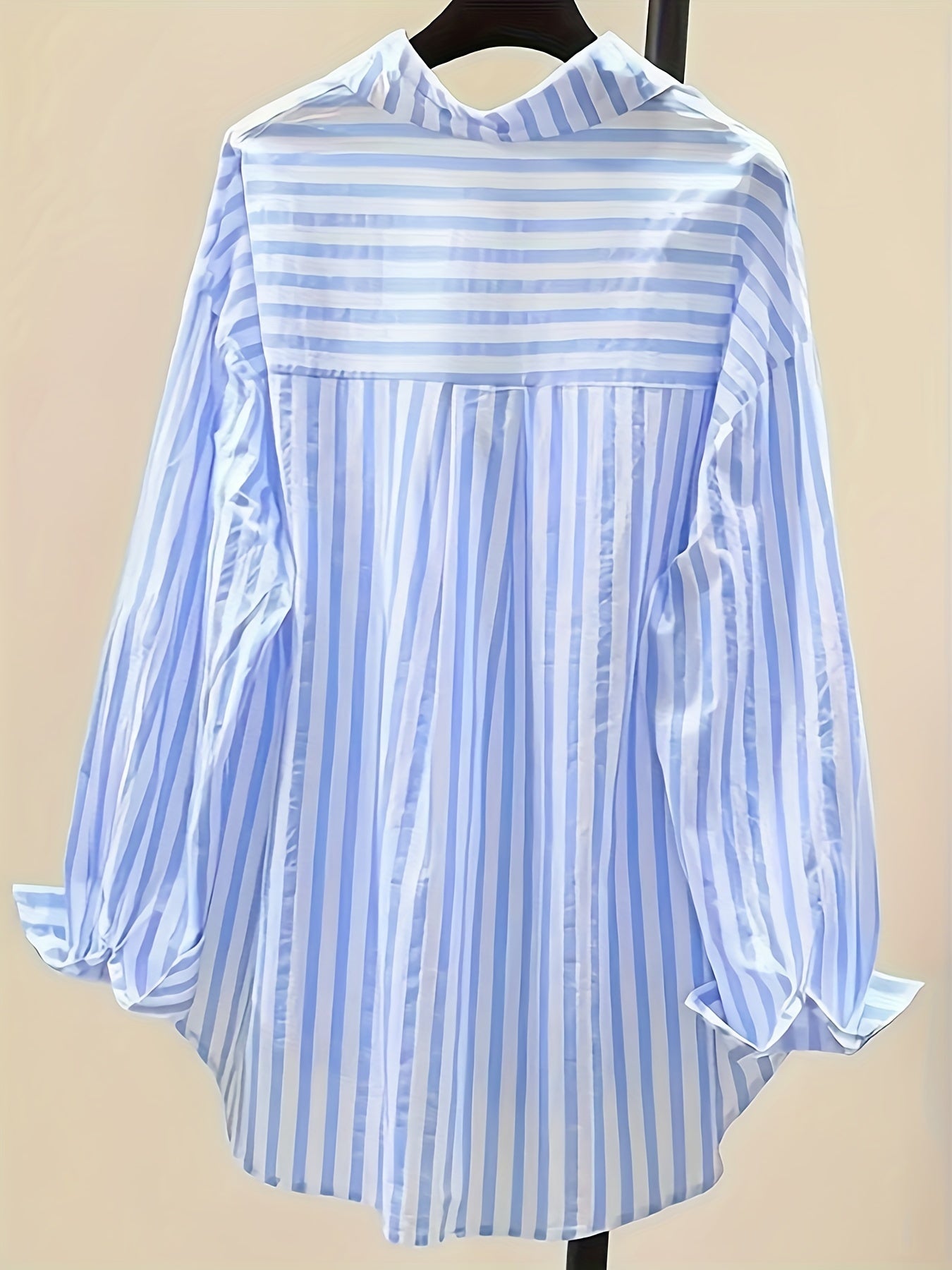 Women's blue and white striped long sleeve button-up shirt with collar, chest pocket. Made of lightweight polyester, machine washable. Suitable for all-season casual or dressy wear.