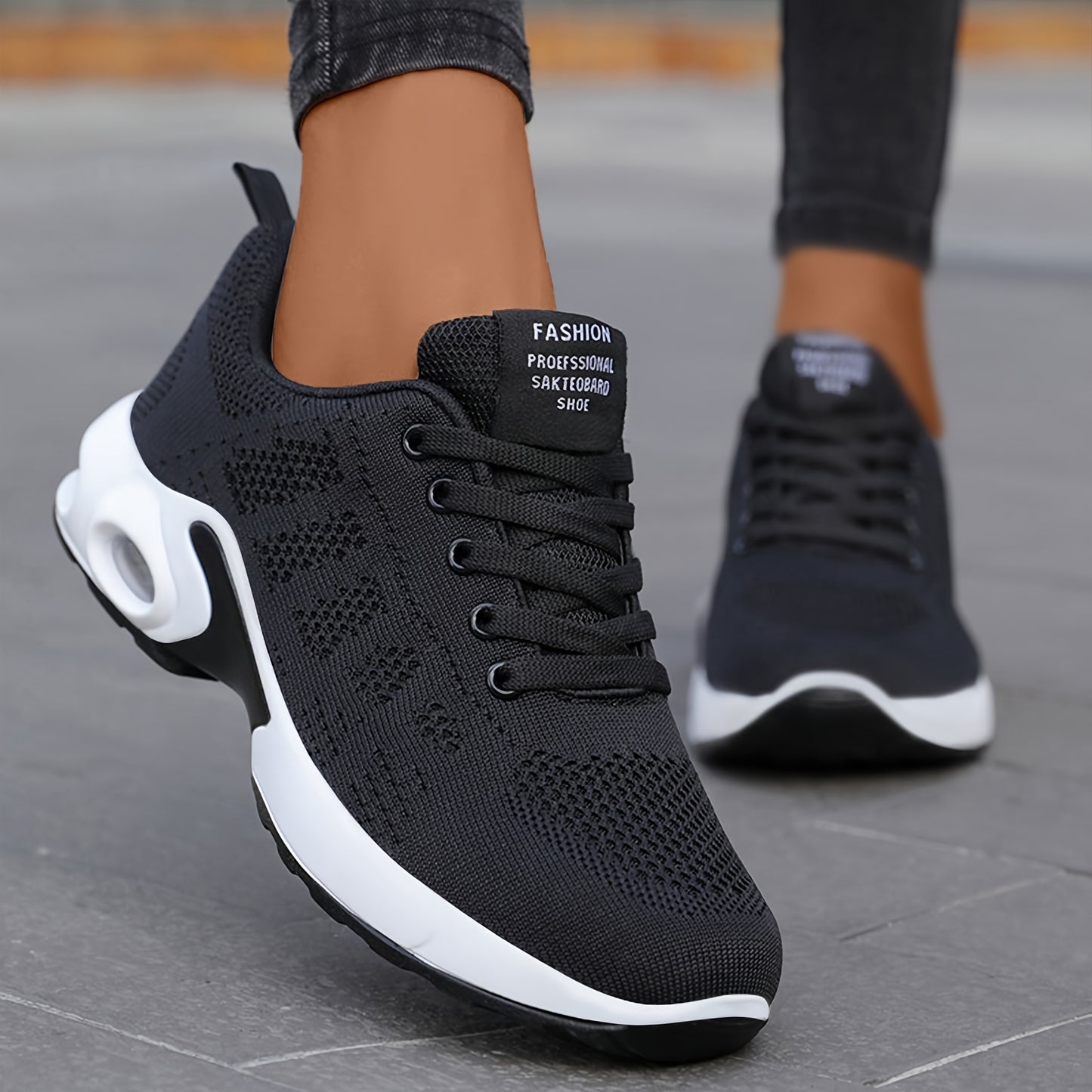 Women's lightweight black knit running shoes with air cushion and mesh upper for all-day comfort and casual wear.