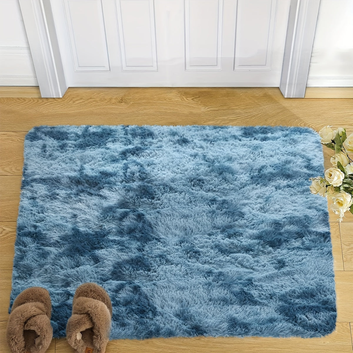 Indulge in comfort and style with this plush faux fur area rug, perfect for your living room or bedroom. Made from soft polyester, this fluffy carpet is non-slip and easy to care for with dry cleaning. Add a touch of luxury to your home decor with this