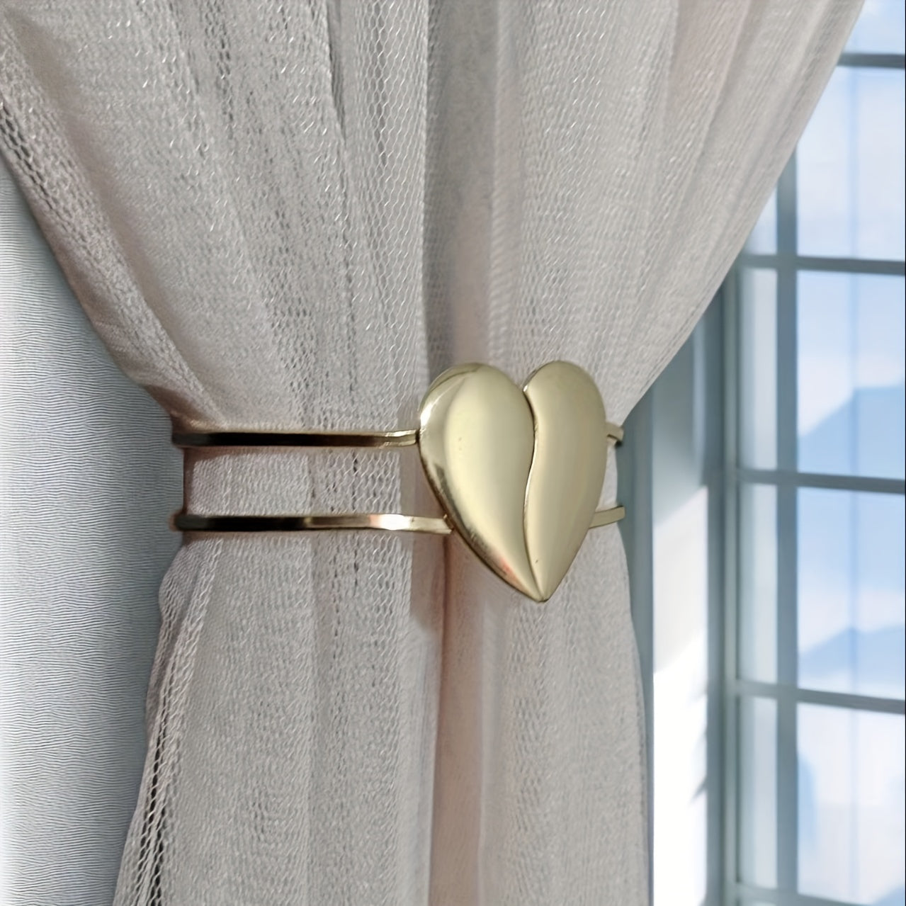 Heart-shaped decor curtain holder made of alloy, featuring a minimalist hollow design. Perfect for use in living rooms, offices, or homes as a stylish and functional curtain accessory.