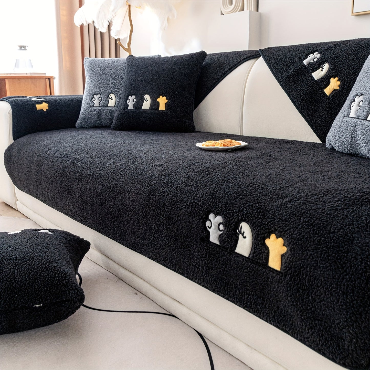 Modern plush sofa cover with paw pattern embroidery, non-slip protection for sofas, machine washable and suitable for various types of furniture.