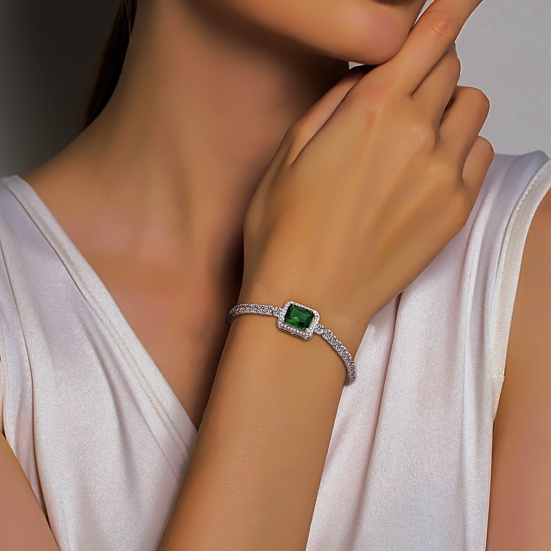 An elegant and luxurious women's bracelet featuring dazzling green Zirconia stones, crafted in adjustable 925 silver weighing just 4.3g. Perfect for daily wear, special occasions, and gifting, especially for Middle Eastern events.