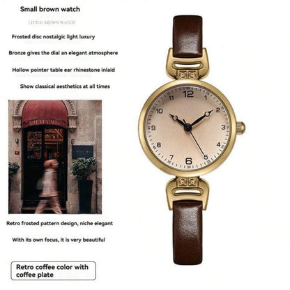 Elegant vintage-inspired women's watch with quartz movement and synthetic leather strap, non-rechargeable button battery.