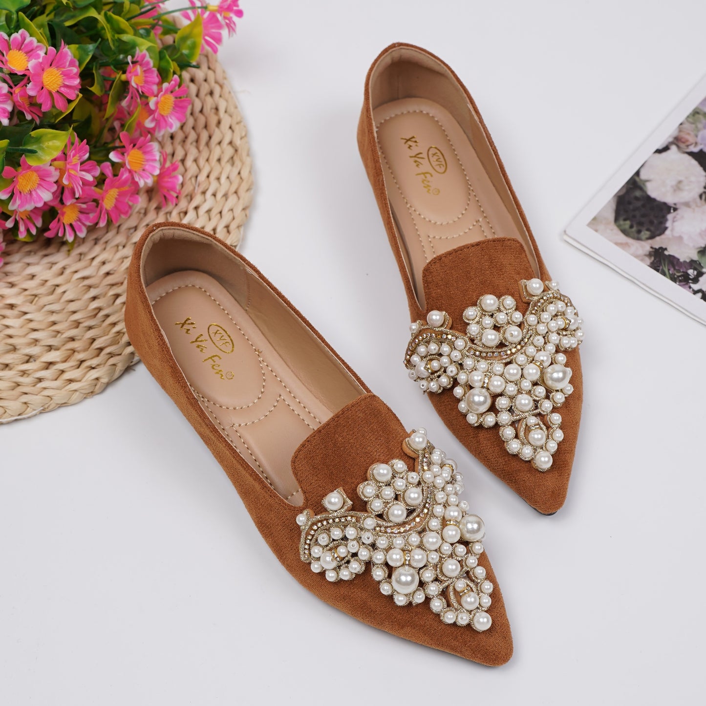 Women's elegant flat shoes with faux pearl decoration, point toe design, and lightweight comfort.