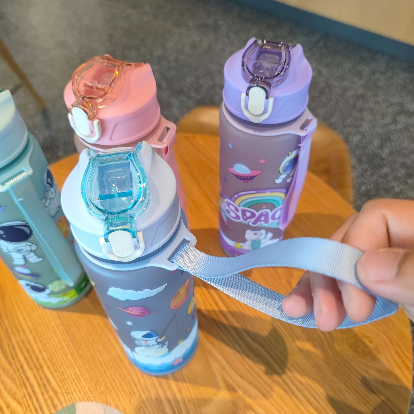 Space-themed astronaut water bottle with straw, lightweight, PVC-free, ideal for outdoor activities and back-to-school gift.