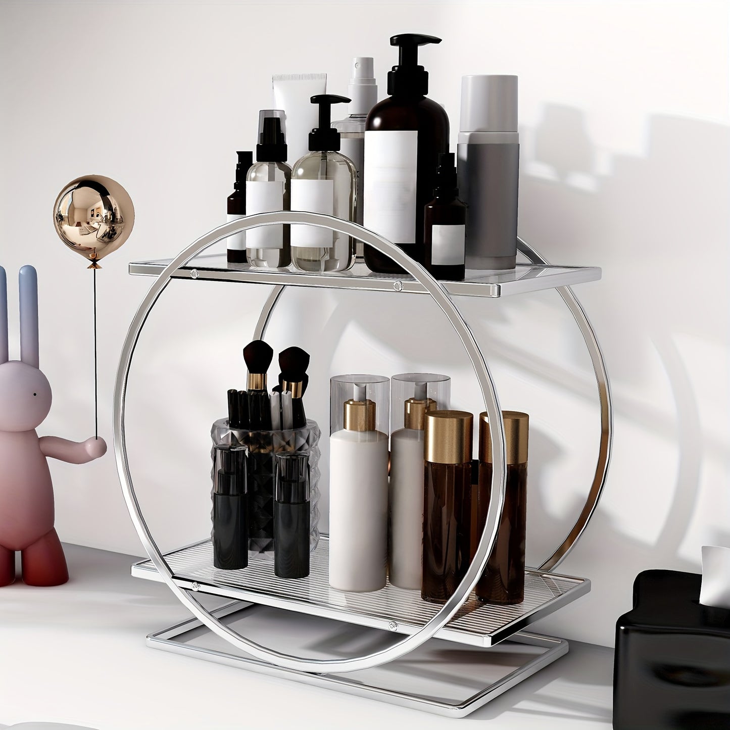 Golden cosmetics storage rack with 2 tiers made of rust-proof cast iron. Large capacity for skincare, lipstick, perfume, and more. Circular design for bathroom and makeup area.