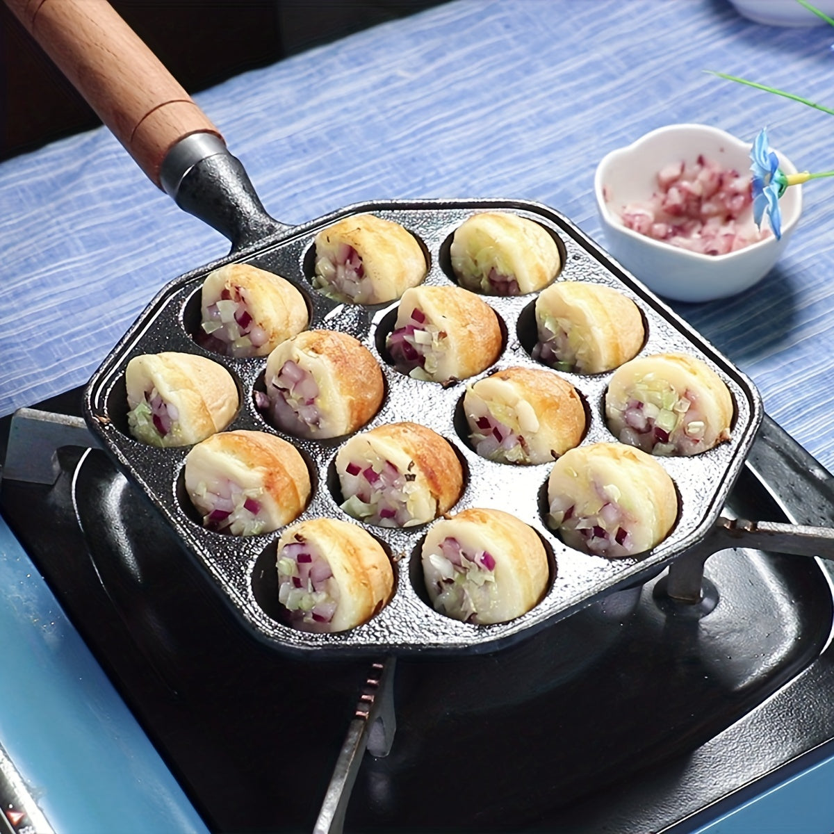 Get perfect takoyaki and poffertjes with our durable cast iron pan! This non-stick octopus ball maker and quail egg mold comes with a sturdy handle for easy use. Remember to hand wash only for best results - ideal for authentic Japanese and Dutch