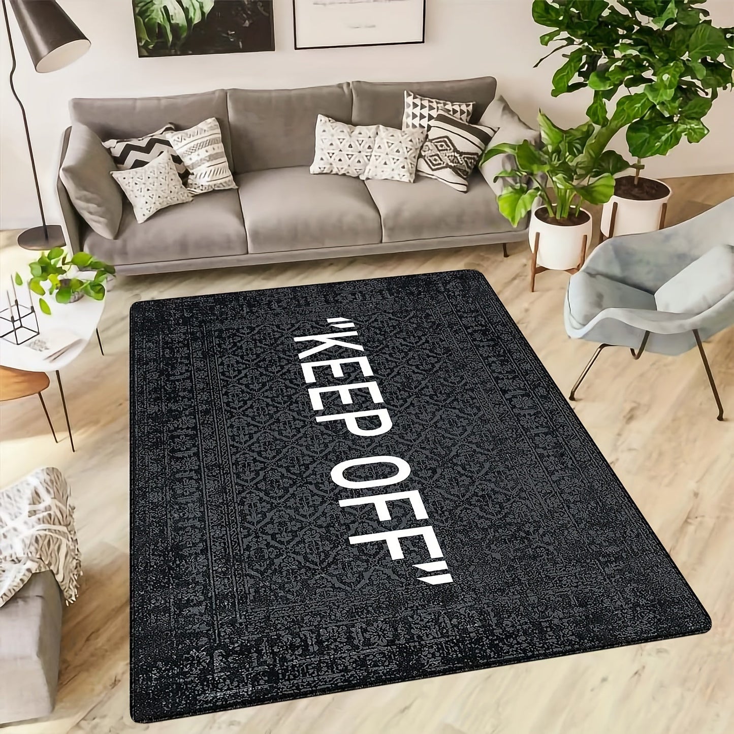 One piece of a black printed soft area rug with the message "Keep Off" - designed for living room and kitchen decor. This non-slip, stain-resistant floor mat has a thickness of 480g/m².