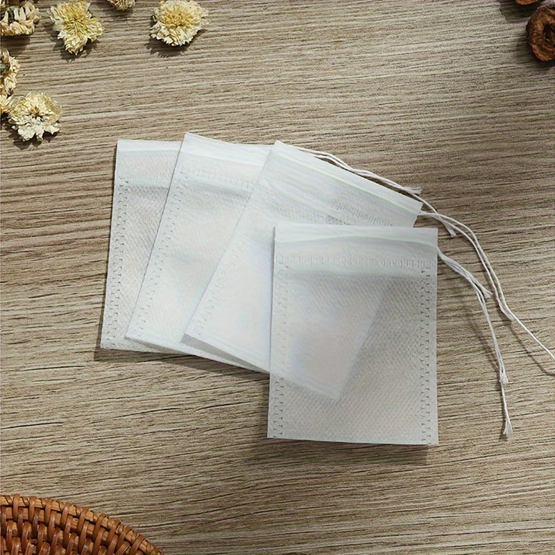 100 pieces of Disposable Drawstring Tea Bags for Loose Leaf Tea, perfect for use in restaurants, hotels, family gatherings, theme parties, weddings, and birthday parties.