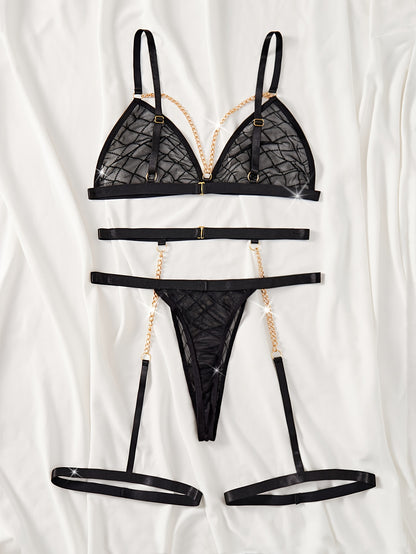 Sheer plaid lingerie set with gold chain detailing. Includes bra, garter belt, and thong.