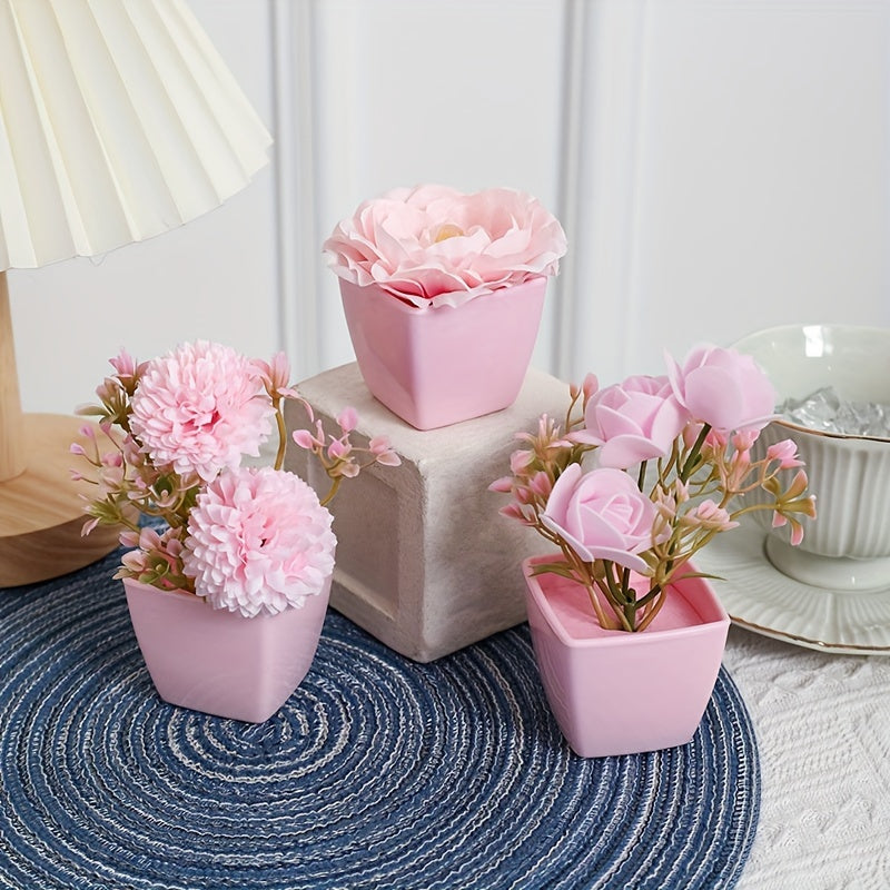 3 mini pink potted plants with faux rose and peach embroidered ball flowers for wedding, home, or office decoration.