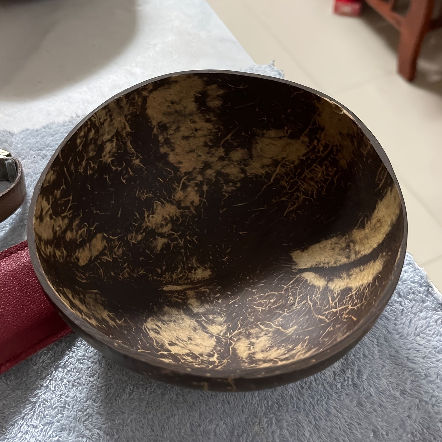 Handmade coconut shell bowl, ideal for serving salads, fruits, and desserts in kitchens or restaurants.