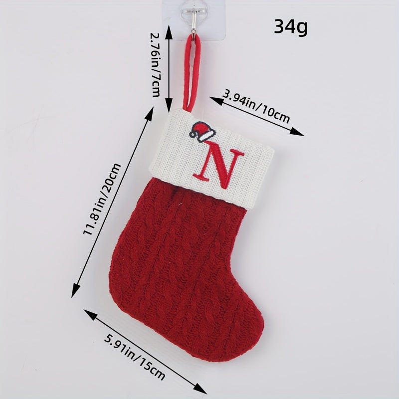 Knitted letter Christmas socks for home tree ornaments; red socks in gift bag for festive attire.