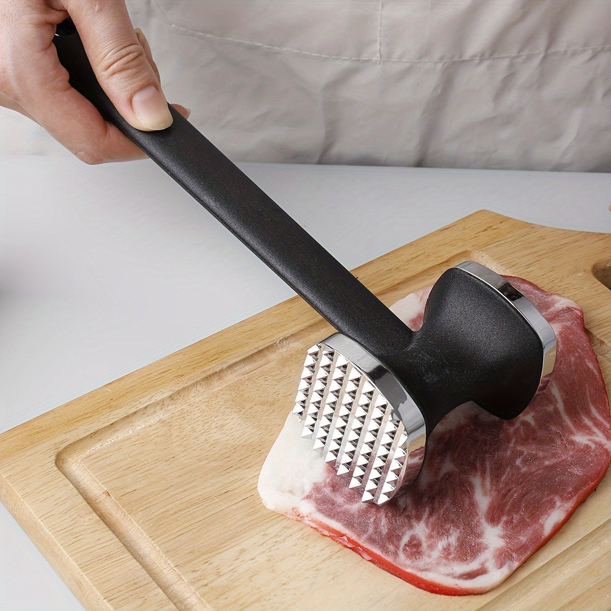 One piece of Zinc Alloy Meat Hammer, a versatile Metal Meat Pounder for household use. This Meat Tenderizer Tool is perfect for knocking meat into tender perfection in the kitchen. Also known as a Meat Tenderizer Hammer, it is a must-have among Kitchen