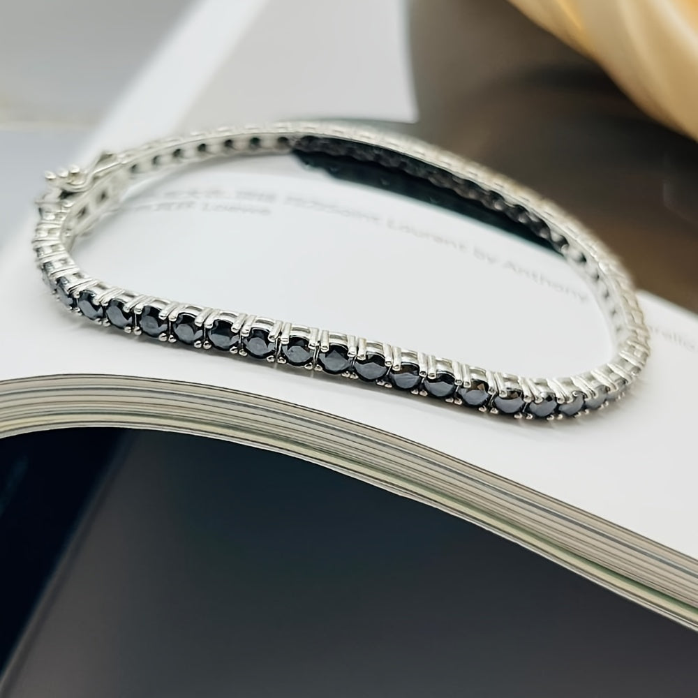 Add a touch of elegance to your outfit with the stunning S925 Sterling Silver Black Moissanite Bracelet featuring a 1.0CT single stone. This luxurious fashion accessory is perfect for parties and dates, making it an ideal gift for Halloween, Christmas