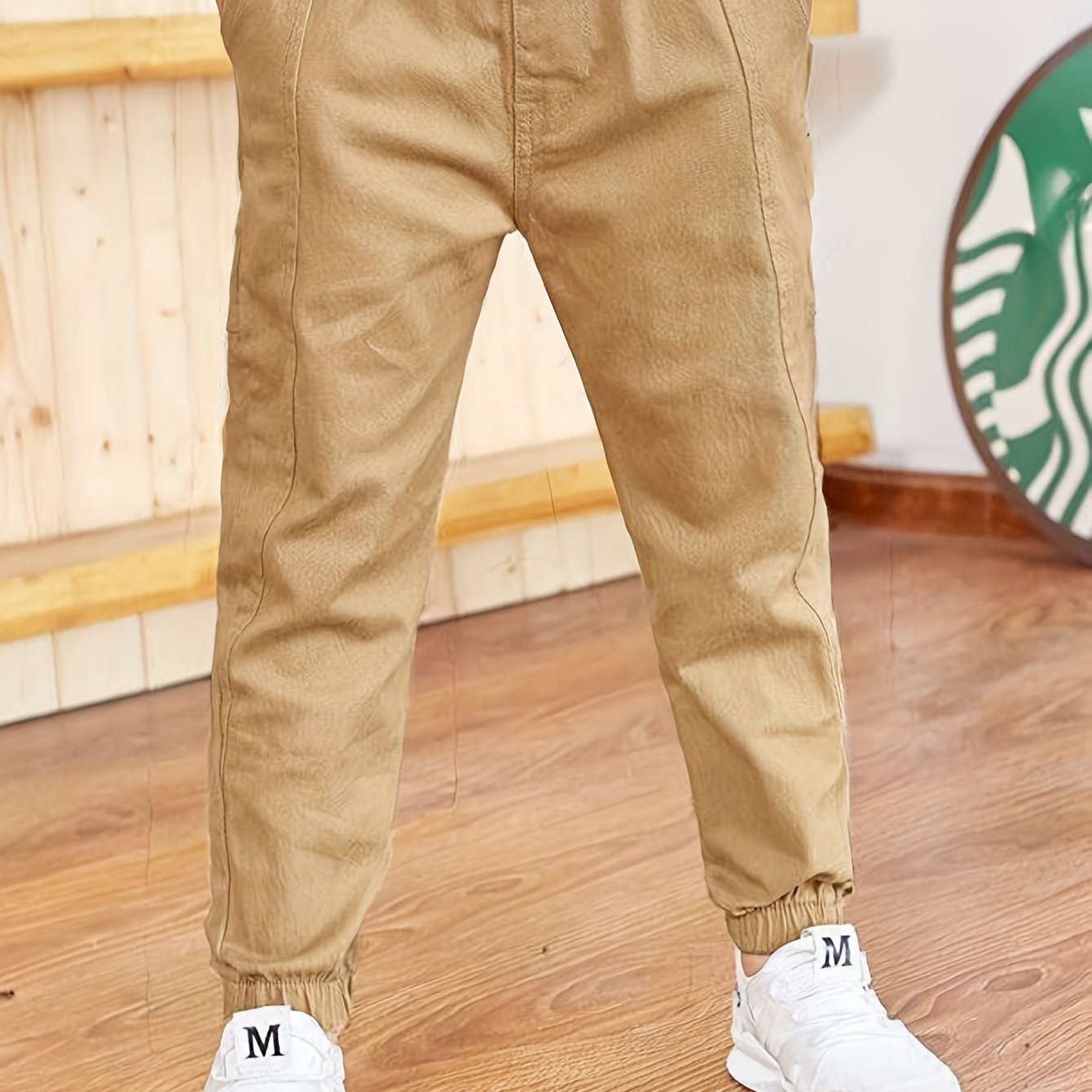 Boys' cotton cargo pants with elastic waist and pockets, ideal for casual and outdoor activities.