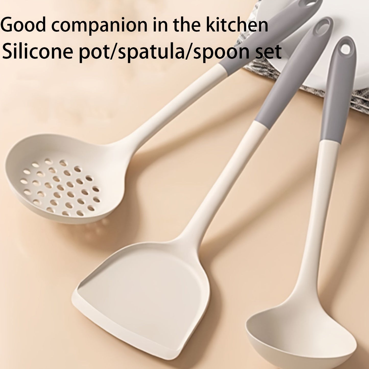 Set of 3 silicone kitchen utensils for safe and non-stick cooking, including a turner, spatula, soup ladle, and pasta server.