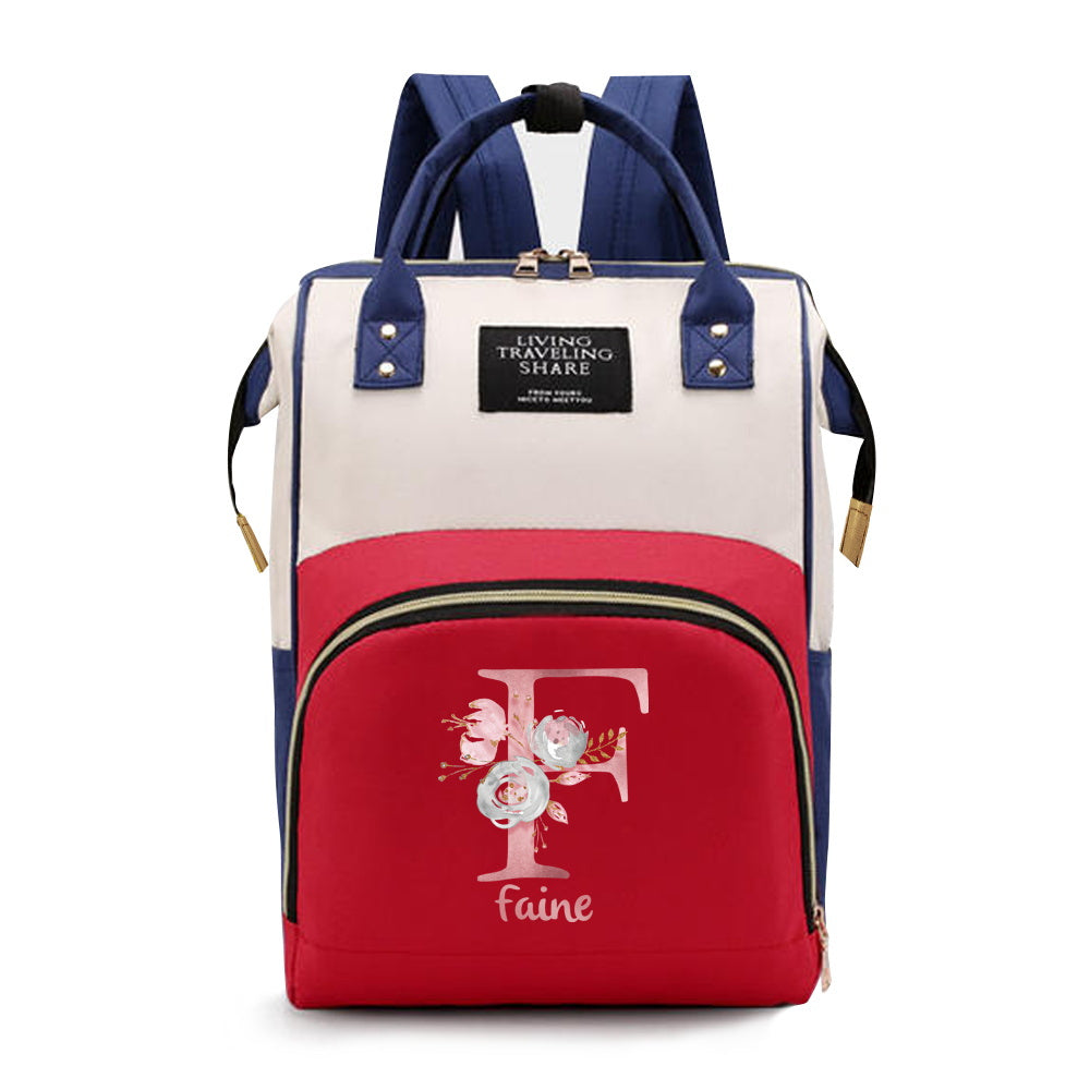 Personalized Mommy Backpack made of durable Oxford cloth with ample storage space for diapers and other essentials. Features customizable initials and name, as well as convenient bottle pockets. Perfect for nursing mothers on-the-go, with options for A-Z