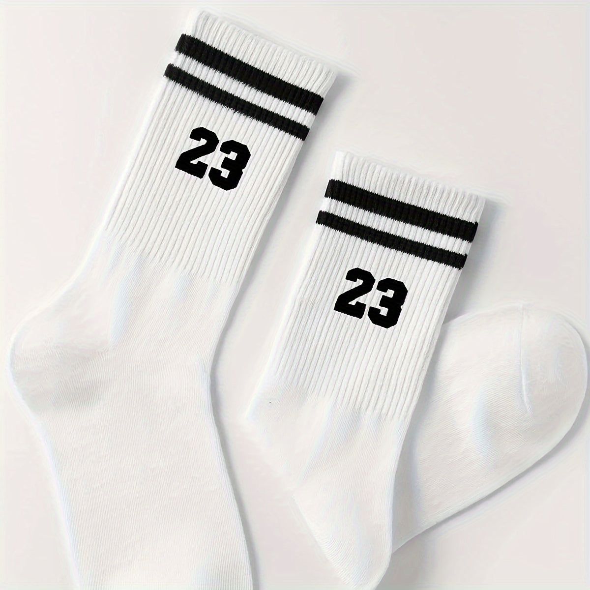 Men's athletic mid-calf socks with striped pattern featuring number 23. Made of 95% polyester and 5% spandex. Hand wash only.