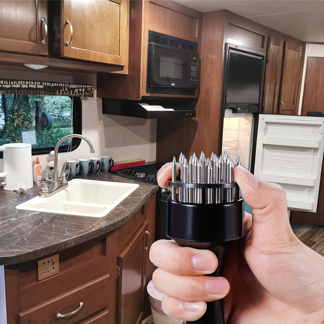 RV kitchen meat tenderizer, stainless steel tool for camping and home kitchens.