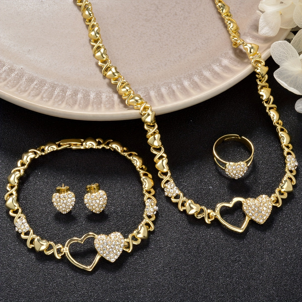 A stylish jewelry set including a dazzling zirconia necklace, bracelet, earrings, and ring, perfect for daily wear or holiday parties. This cute and elegant set makes a great gift for any woman in your life.