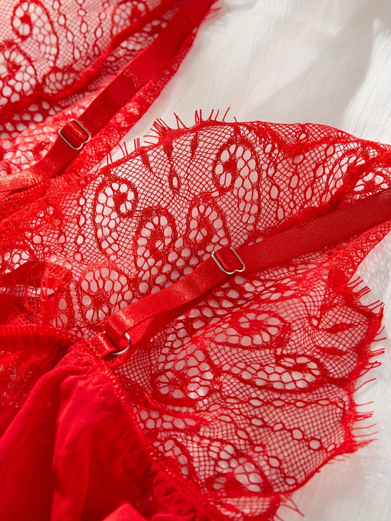 Sexy red lingerie set with lace and bow details, includes dress and thong. Perfect for women.