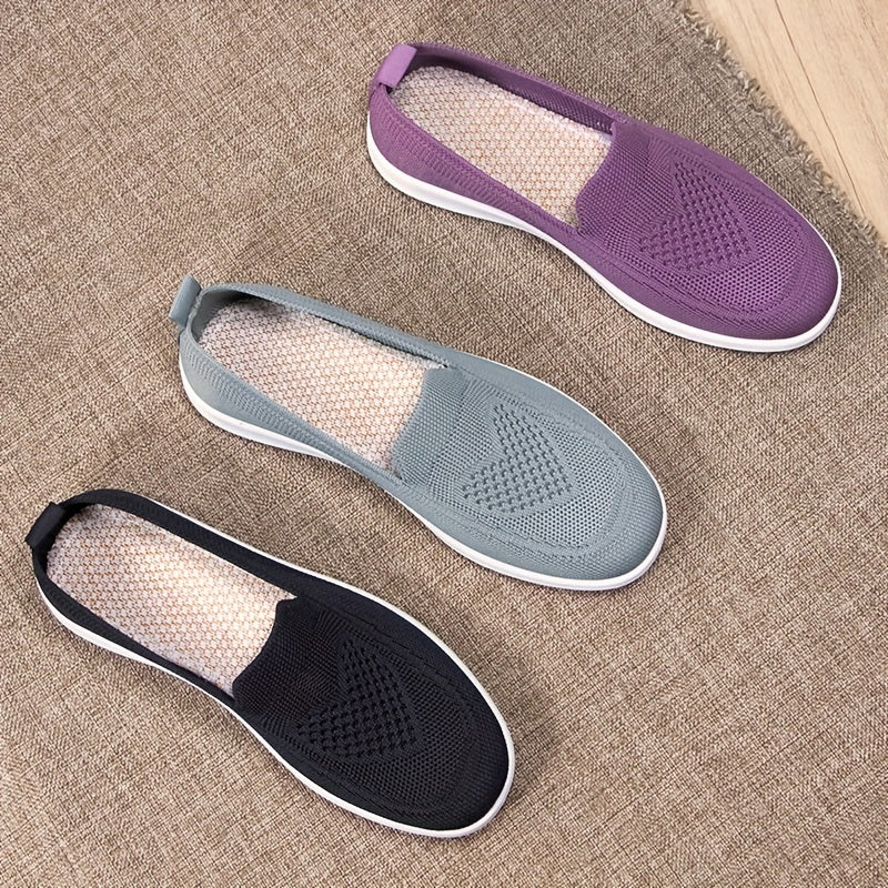 Women's slip-on flats with comfortable fabric upper, flax insole, and faux sole for easy daily wear.