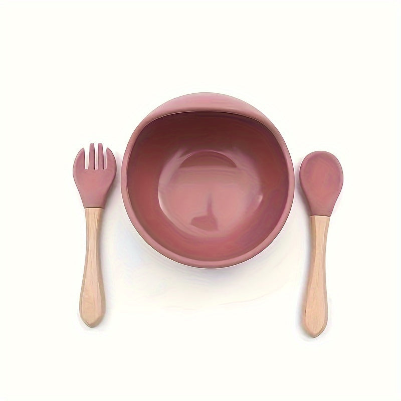 Three pieces of silicone feeding bowl, fork, and spoon set with durable suction bowl. Includes feeding kit with wooden handle, non-slip design, and microwave safe.