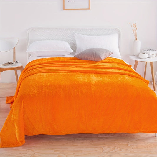 One piece of a new 220-gram solid color flannel blanket cover, perfect for casual naps, rest on the sofa, or keeping warm. This orange blanket is soft and cozy, ideal for use on the couch, sofa, office, bed, or during camping and travel. A versatile gift