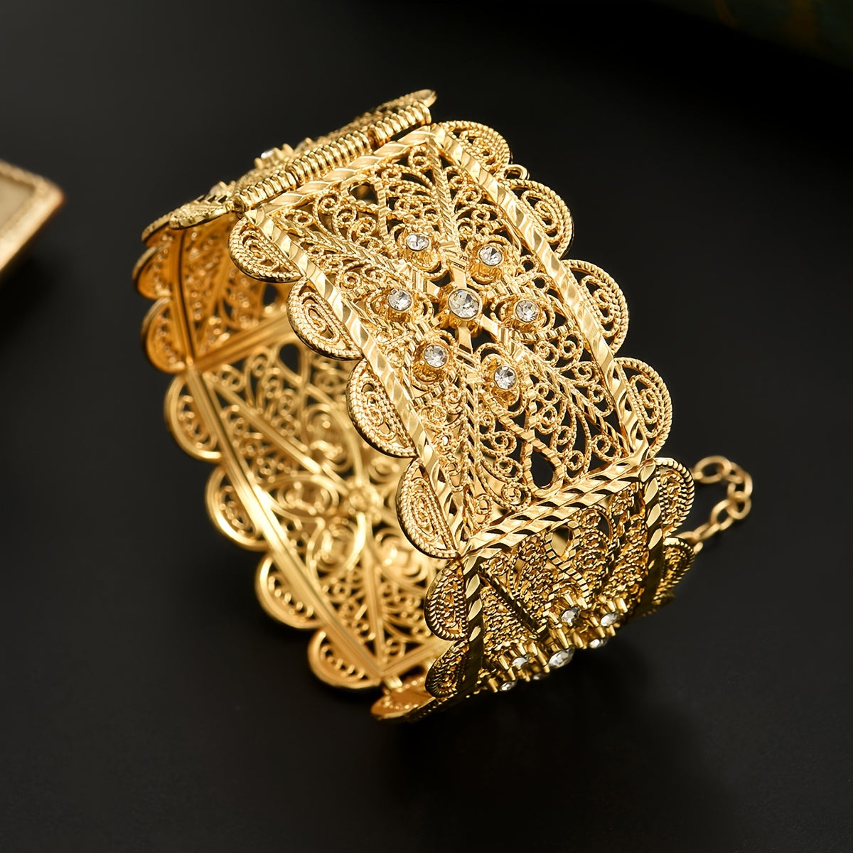 Luxurious 24K Gold Plated Zinc Alloy Bangle featuring Synthetic Stones in an Arabian Style Open Cuff design. This bracelet is adorned with a November birthstone and a beautiful floral theme, making it a perfect accessory for weddings, banquets, and