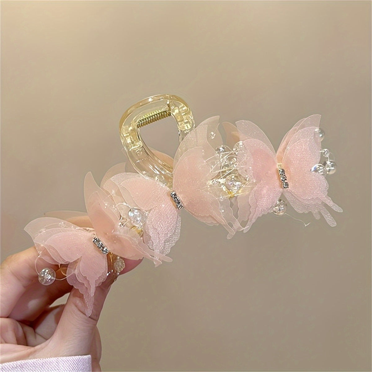 Stylish golden butterfly hair clip with crystal beads - perfect for chic updos & buns.