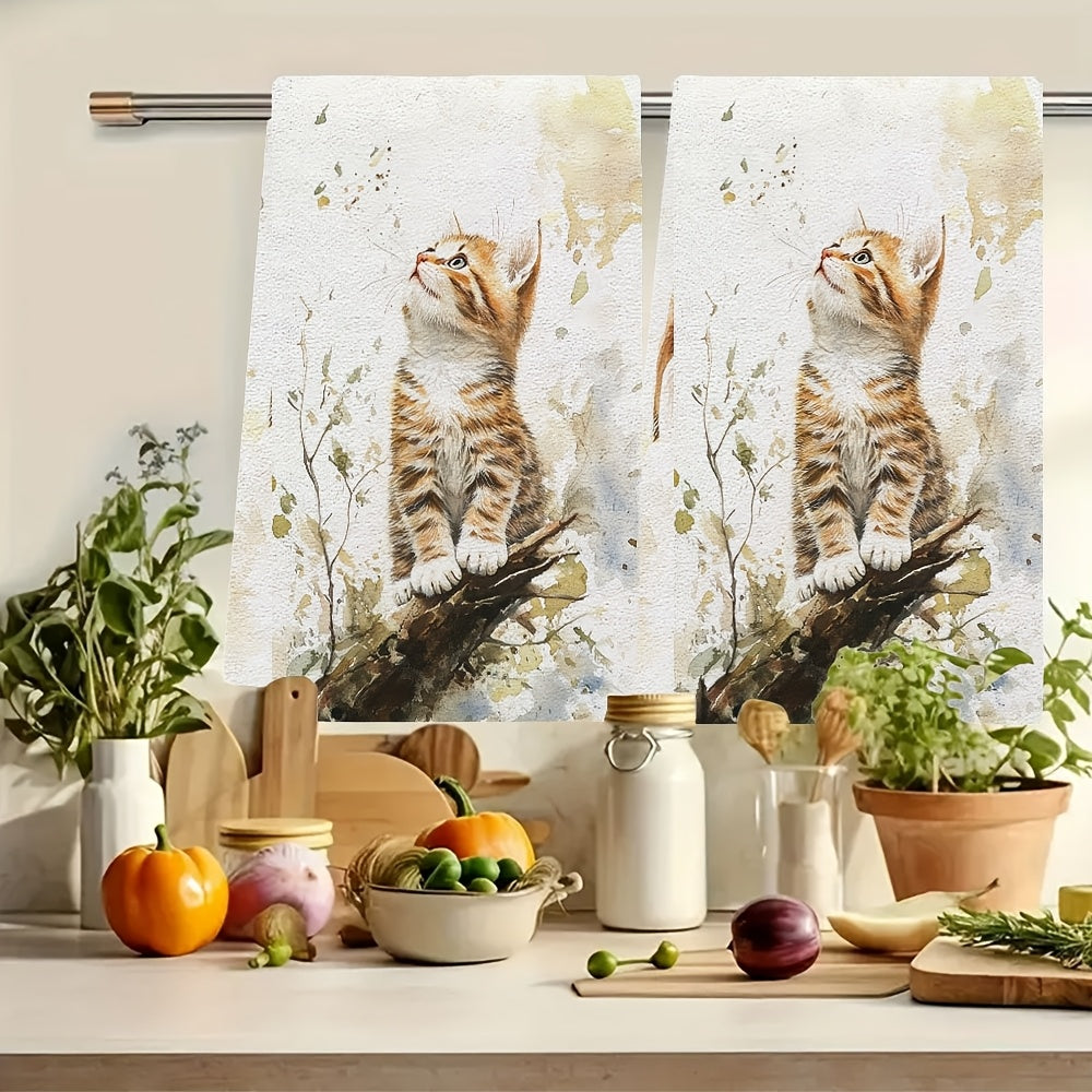 Set of 2 Ultra Soft Kitchen Towels featuring an Endearing Orange Kitten Design. These towels are highly absorbent and quick-drying, perfect for use in the kitchen. They are machine washable and ideal for cooking and baking. Each towel measures