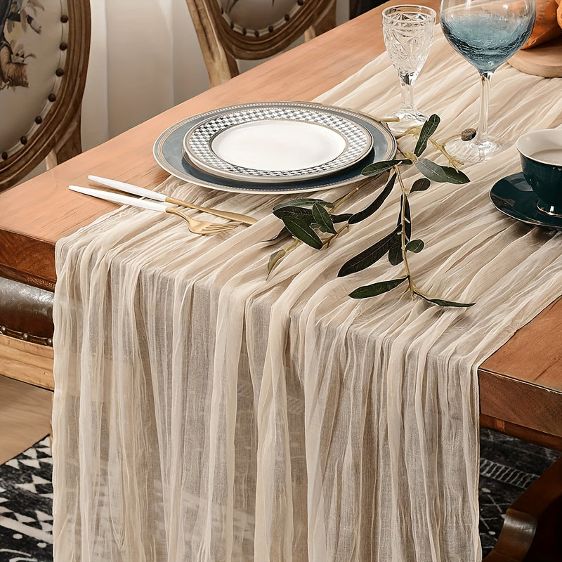 Boho table runner made of pleated polyester gauze, perfect for rustic or wedding decor. Ideal for holiday parties or showers.