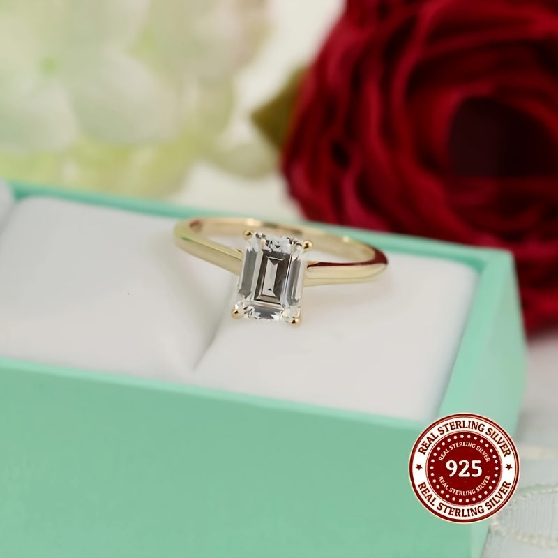 This stunning 925 Sterling Silver ring features a rectangular Cubic Zirconia stone, exuding elegance and luxury. It is perfect for both casual wear and gifting, with its simple yet sophisticated golden design. The simulated diamond comes in sizes of 1CT