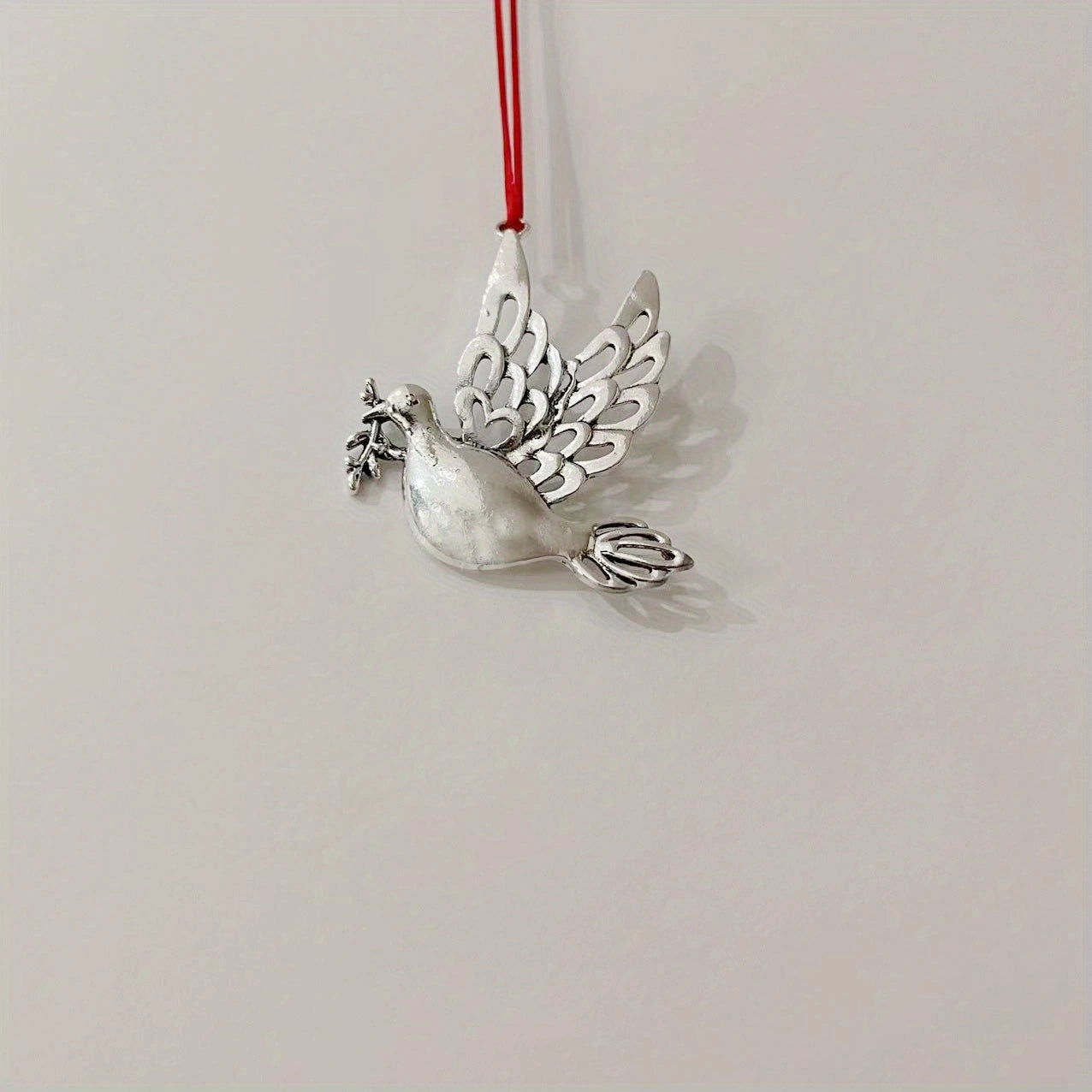 Festive metal Christmas tree ornament featuring bear, peace dove, and mandarin duck designs with letter and snowflake details - ideal for holiday decorating and home décor.