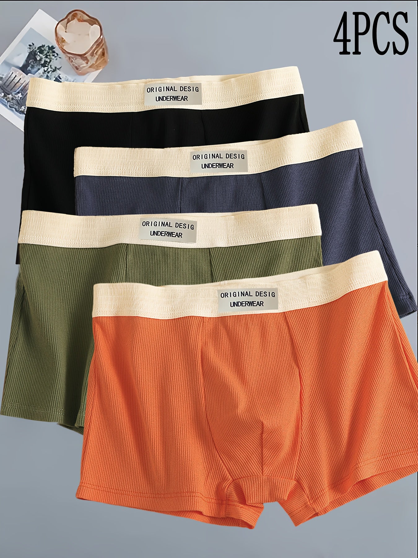 4-Pack Men's Boxer Briefs made of 95% Polyester and 5% Spandex with medium stretch knit fabric, solid color shortie underwear, casual sports trunks, lightweight and comfortable fit.