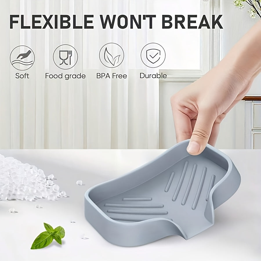 Silicone sink mat with soap dispenser, sponge drain, and countertop storage tray for drying and organizing bathroom accessories.